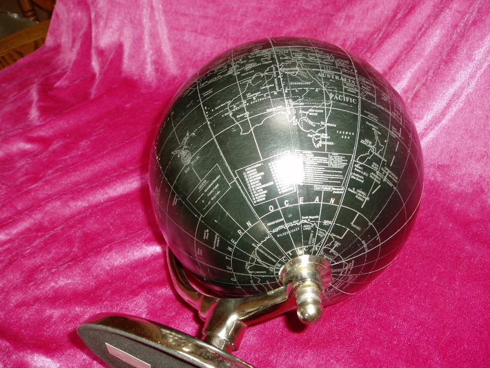 "DECORATIVE ROTATING DESKTOP WORLD/OCEAN GLOBE", black & silver, metal base