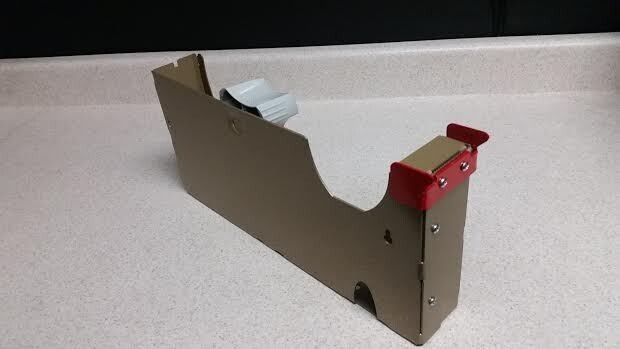 10 inch tape dispenser 2" wide 3" core. Packaging tape dispenser commercial duty