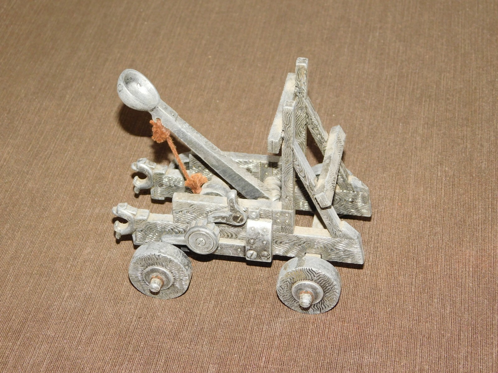 VINTAGE TOY 5" X 4" X 5 1/2" HIGH METAL CATAPULT