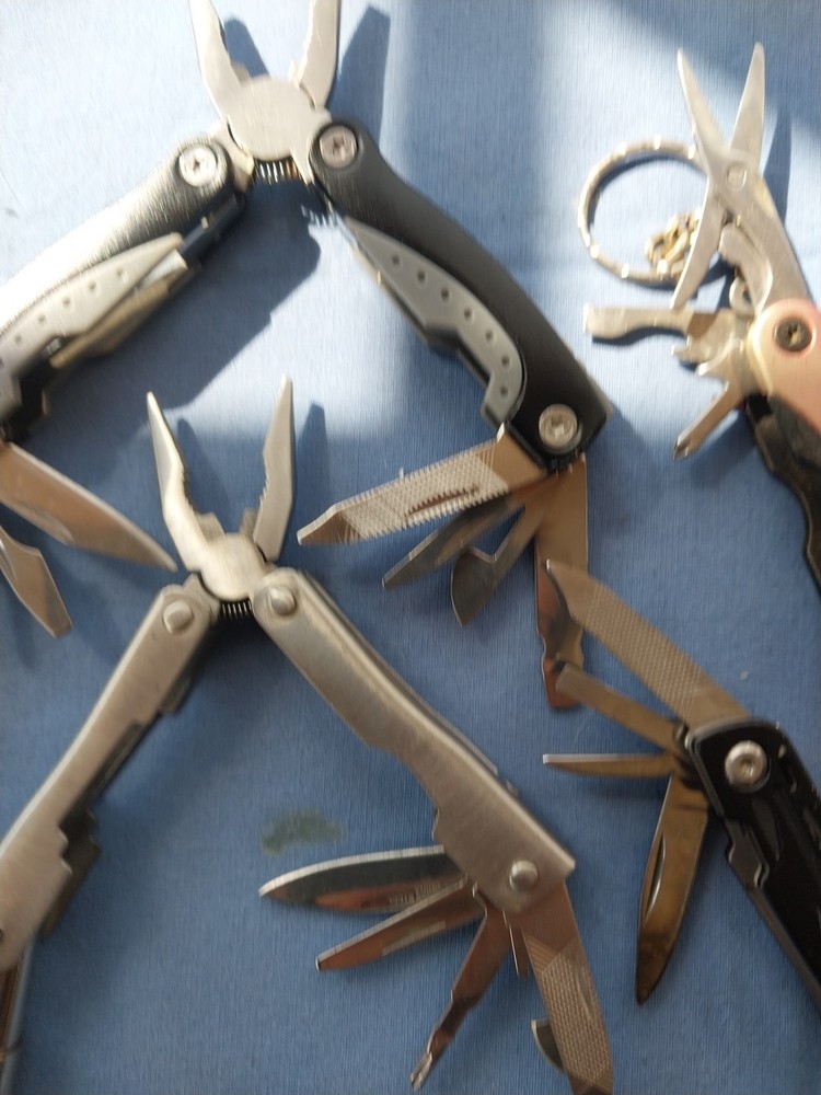 4 small multitudes with pliers knife scissors screwdriver's