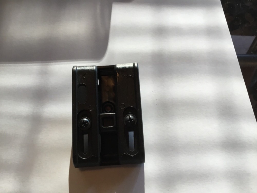 ITac paddle holster belt loop adapter.