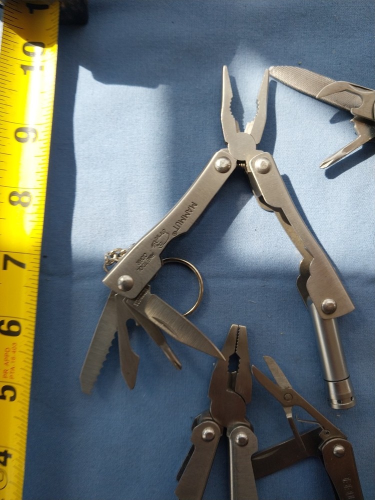 4 small multitudes with pliers knife scissors screwdriver's