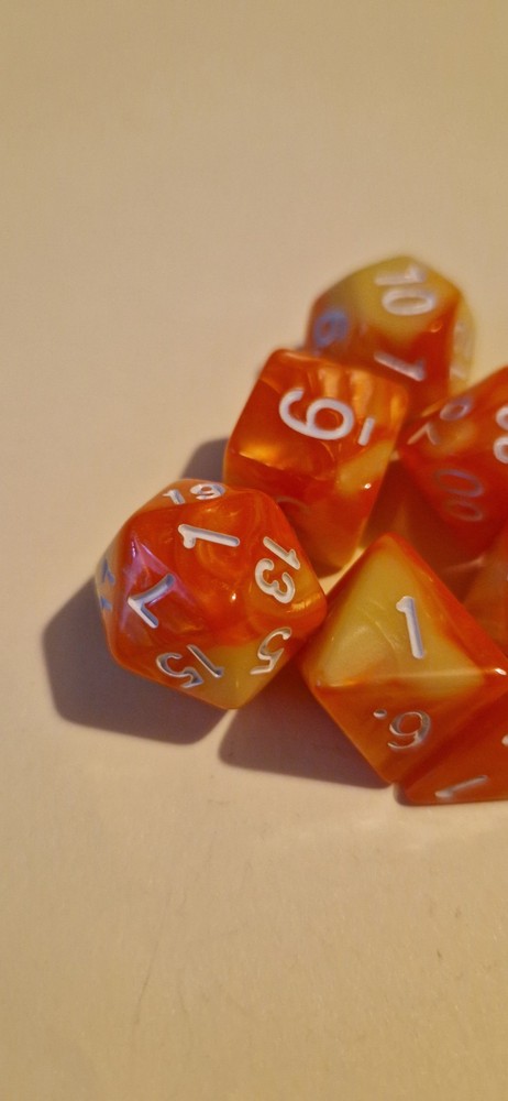 Orange and yellow marble effect D&D polyhedral dice set