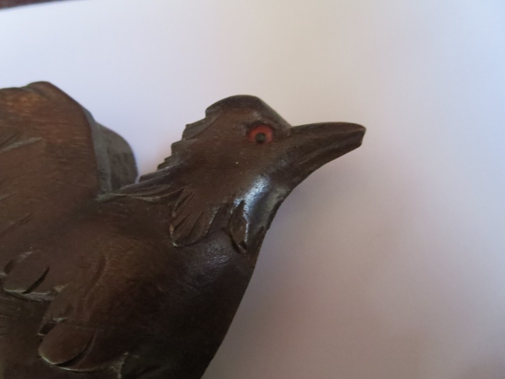 Old Cuckoo clock with articulated bird