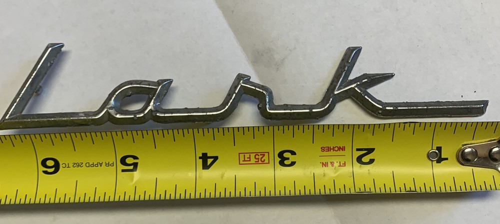 VINTAGE STUDEBAKER LARK METAL EMBLEM Read