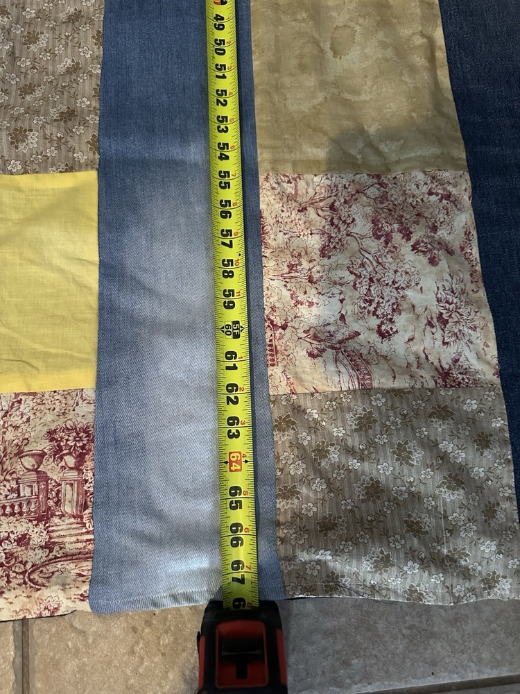 A handmade, multi-fabric strip-pieced quilt.