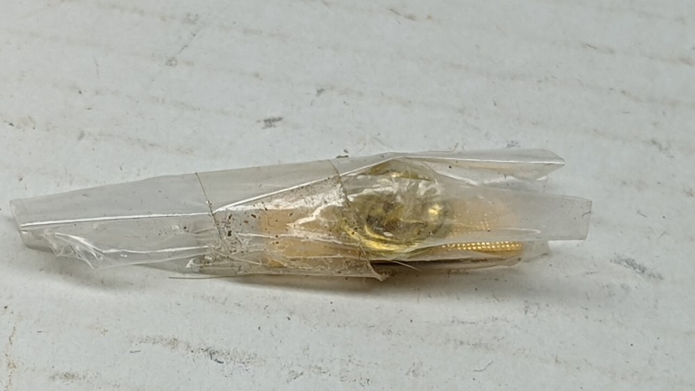 Campagnolo gold chest pin
