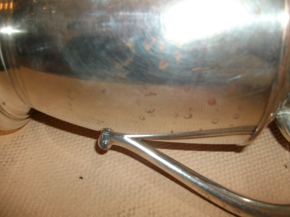 Silver water pitcher with    round bottom