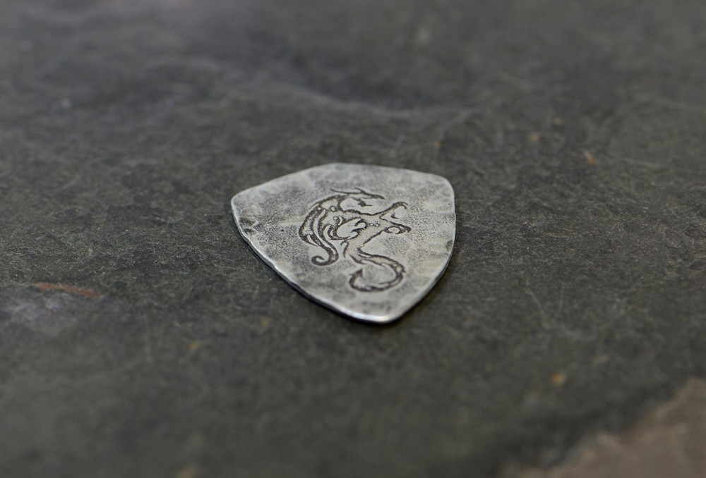 Sterling silver dragon guitar pick in shield shape