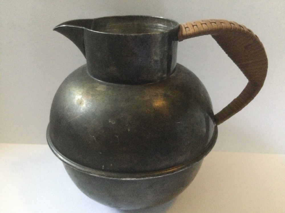vintage silver plated pitcher with rattan handle
