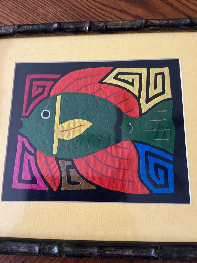 Mola, a form of textile art Multicolored fish