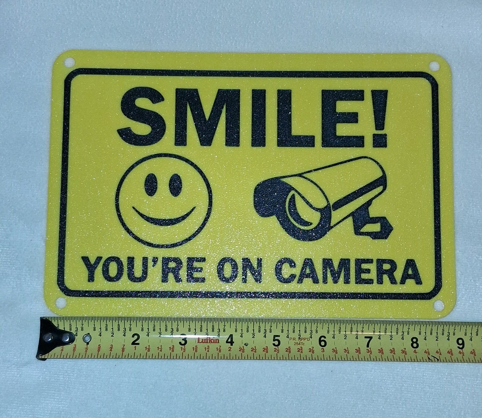 Smile You're on Camera Sign 6"x9" Plastic