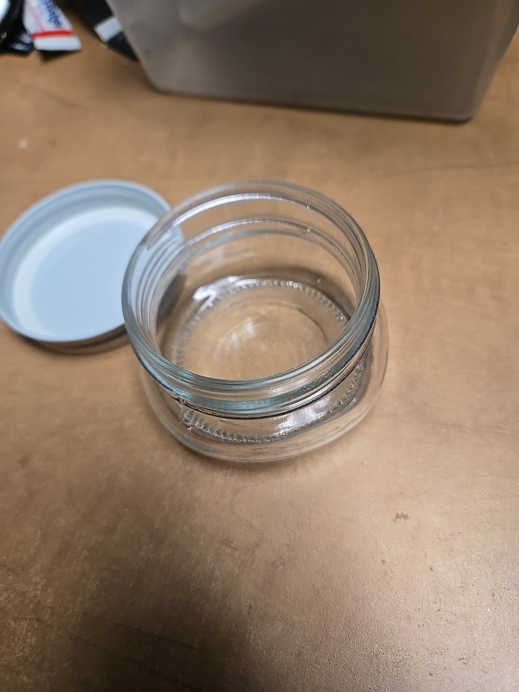 6 small mouth jars And lids