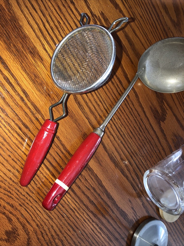 Vintage red handle measuring cup/chopper and two red handle utensils!