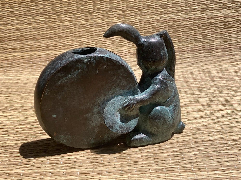 Bunny Vase drumming on a drum