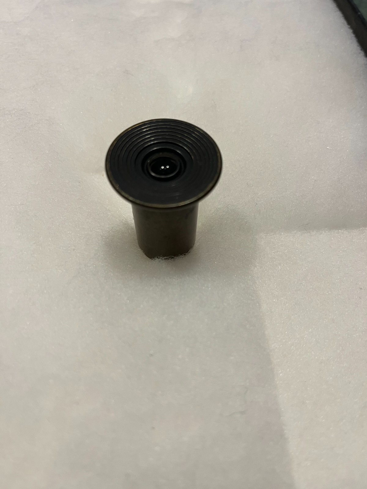 Old brass microscope lens ? Includes its own threaded brass storage tube