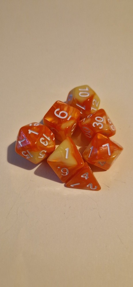 Orange and yellow marble effect D&D polyhedral dice set