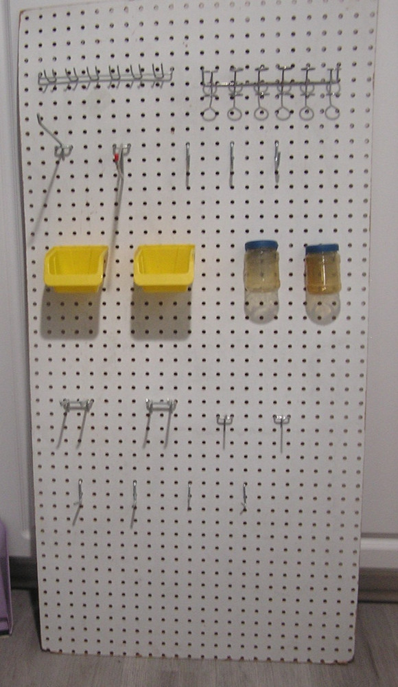 Composite Pegboard with Hooks and Bins Moounted