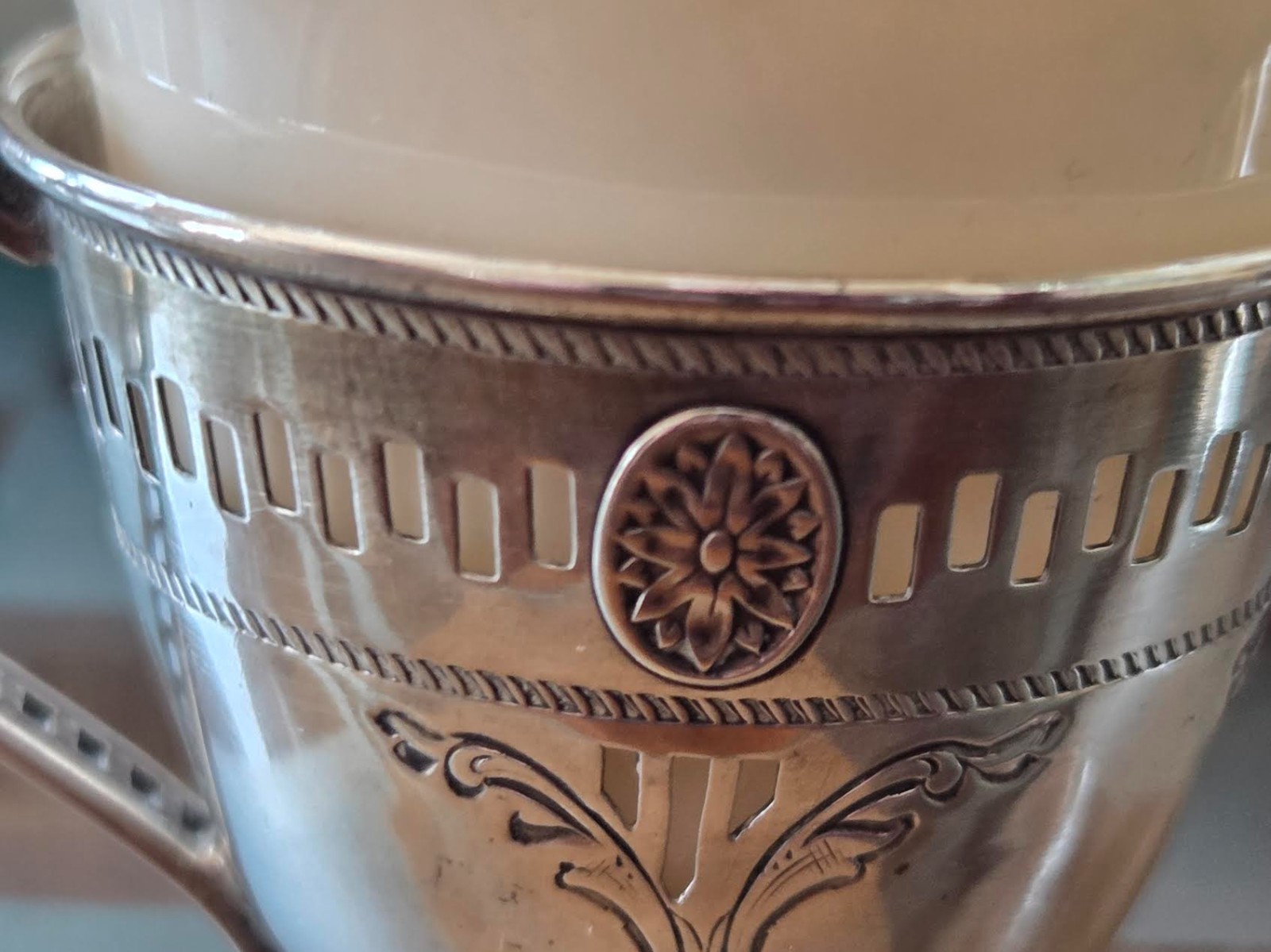 A Pair of Sterling Silver Teacups with 6 Porcelain Inserts