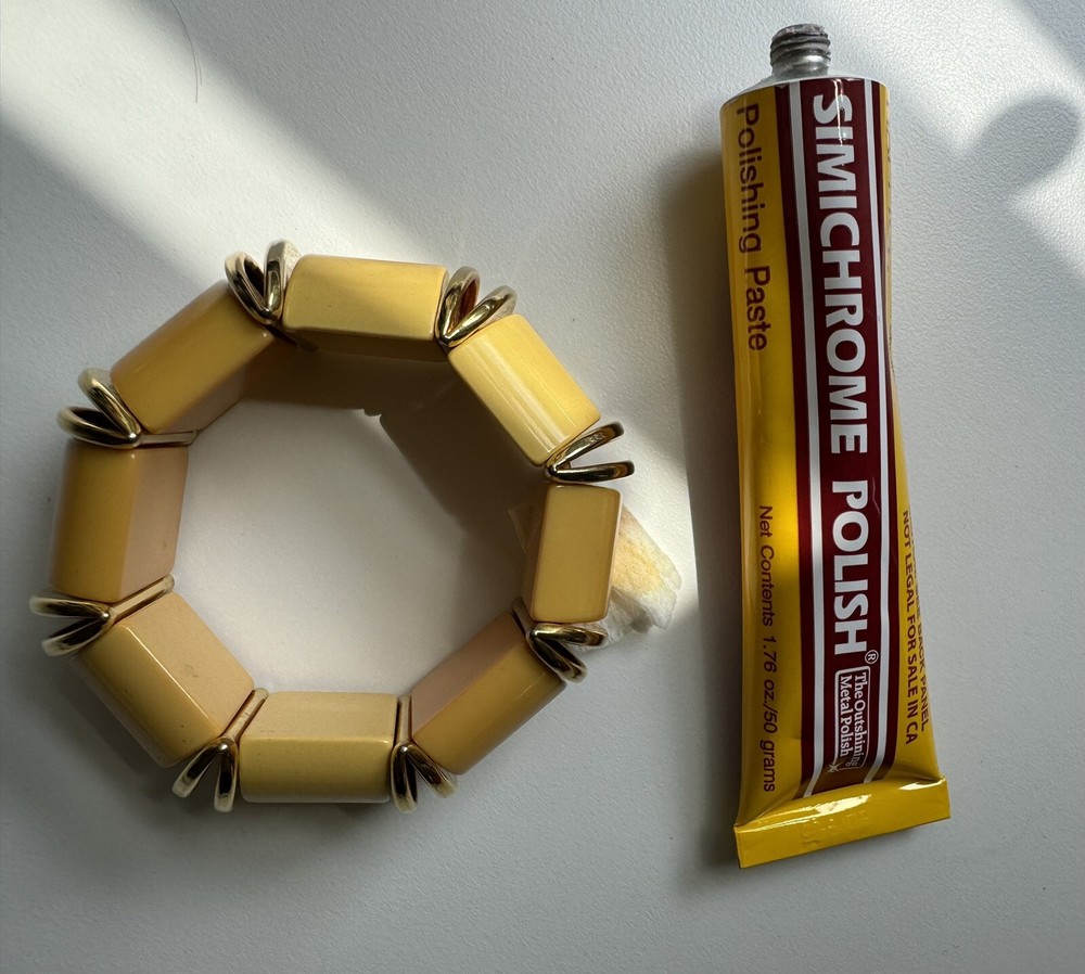 Nice butterscotch bakelite expandable bracelet with deco gold inserts