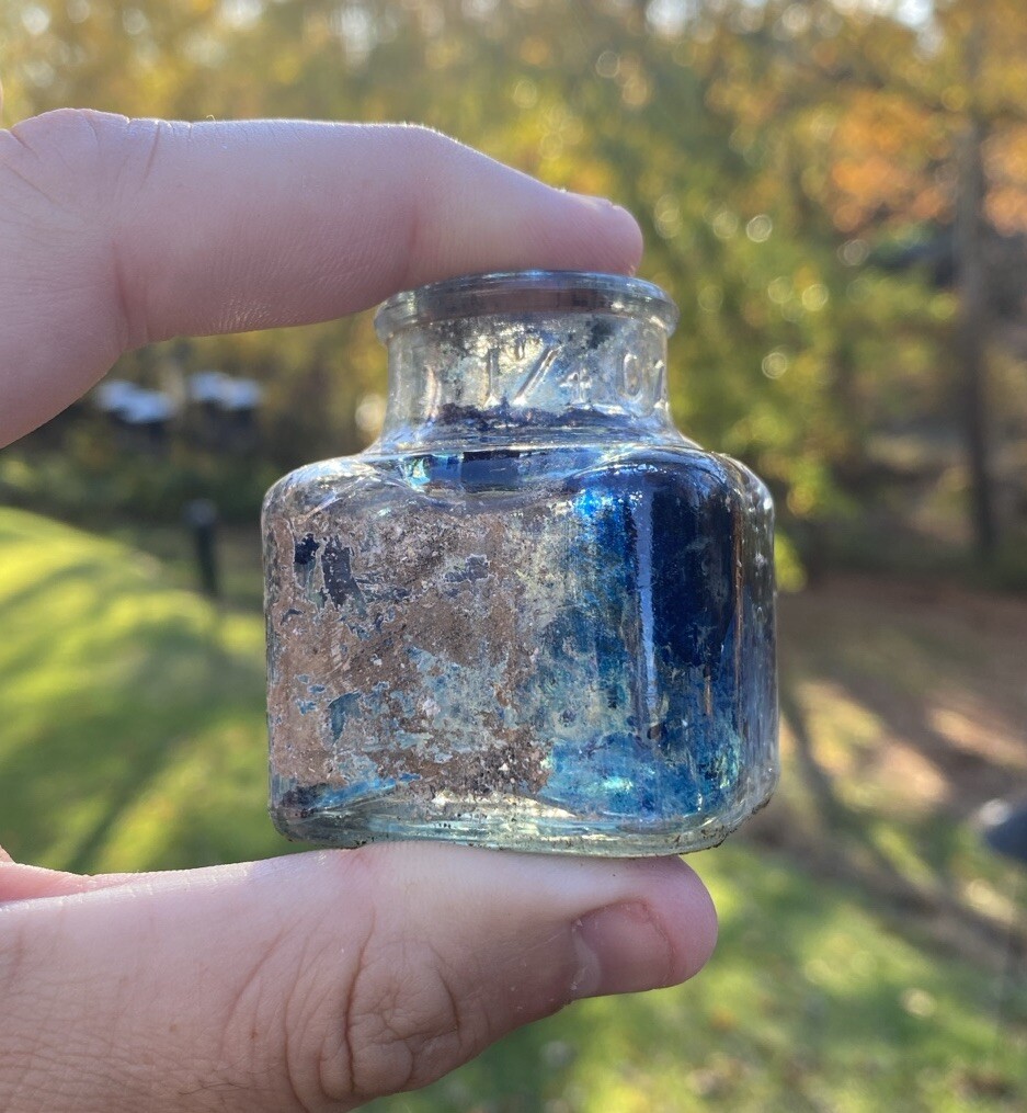 Clear Inkwell With Blue Ink And Partial Label