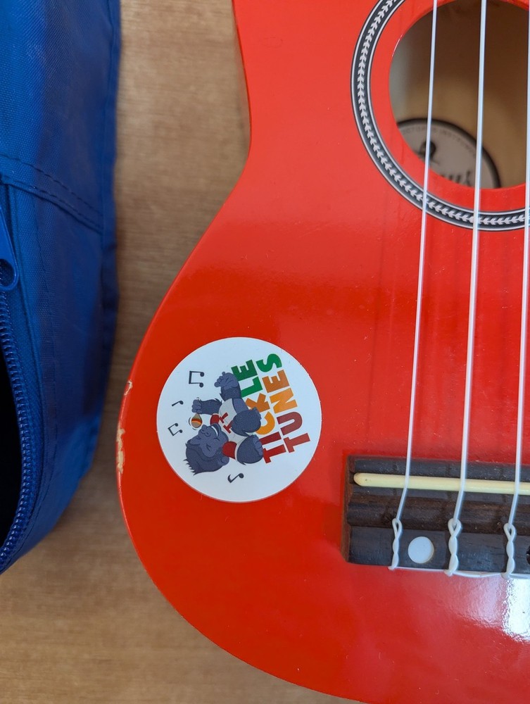 Octopus Soprano Ukulele Red with 4 Strings Includes Case for Beginners