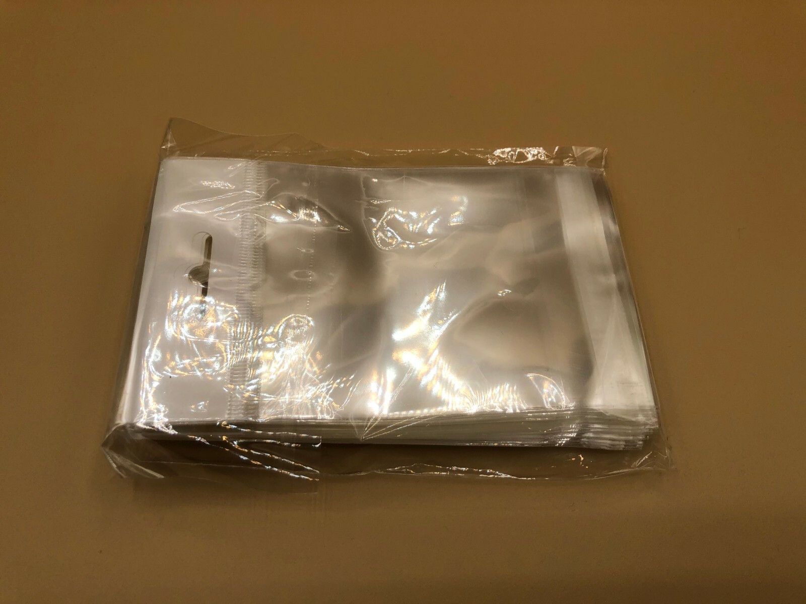 100 Clear Cello Bags HANG TOP, Resealable Self Adhesive OPP Poly Hang Hole bag