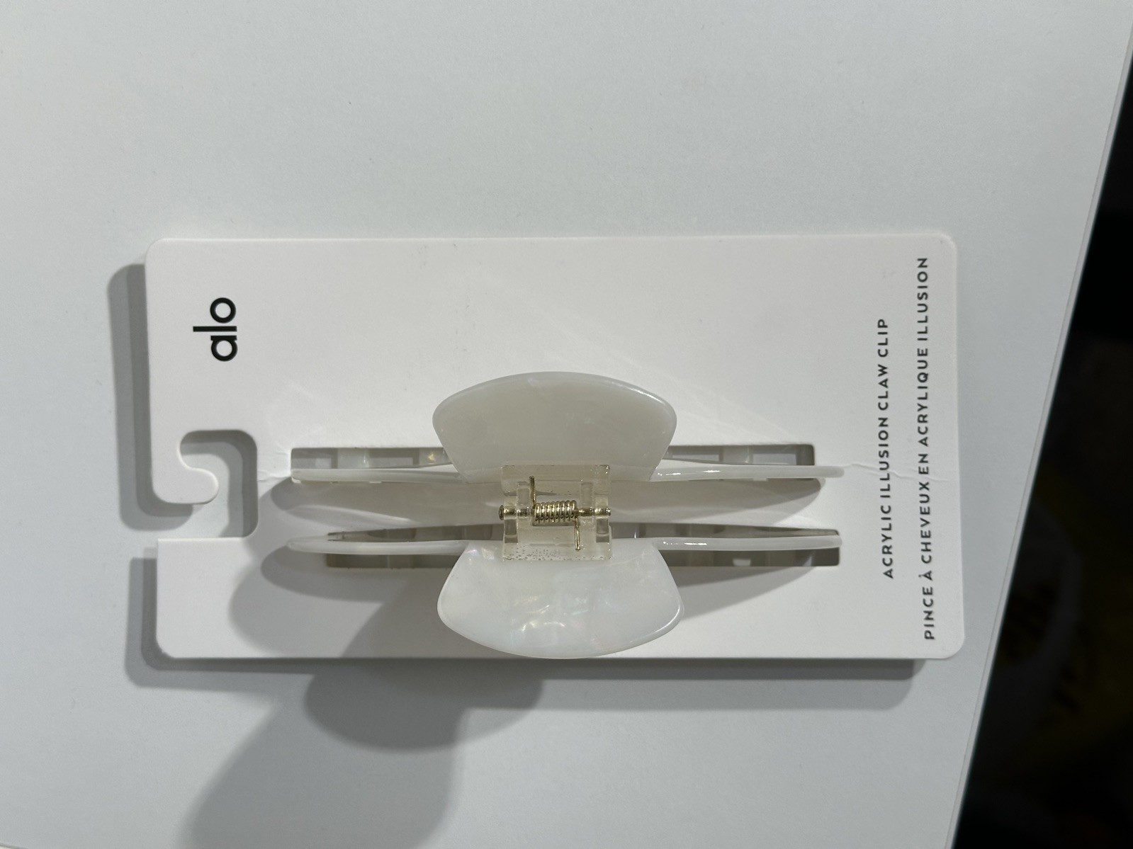 Alo Yoga white acrylic illusion hair clip