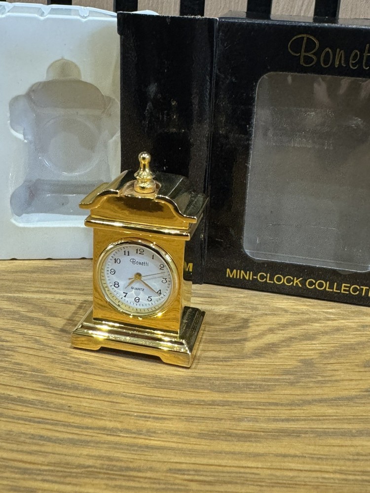 Bonetti Clock Collection comprising 7 boxed gold finished analogue mini-clocks