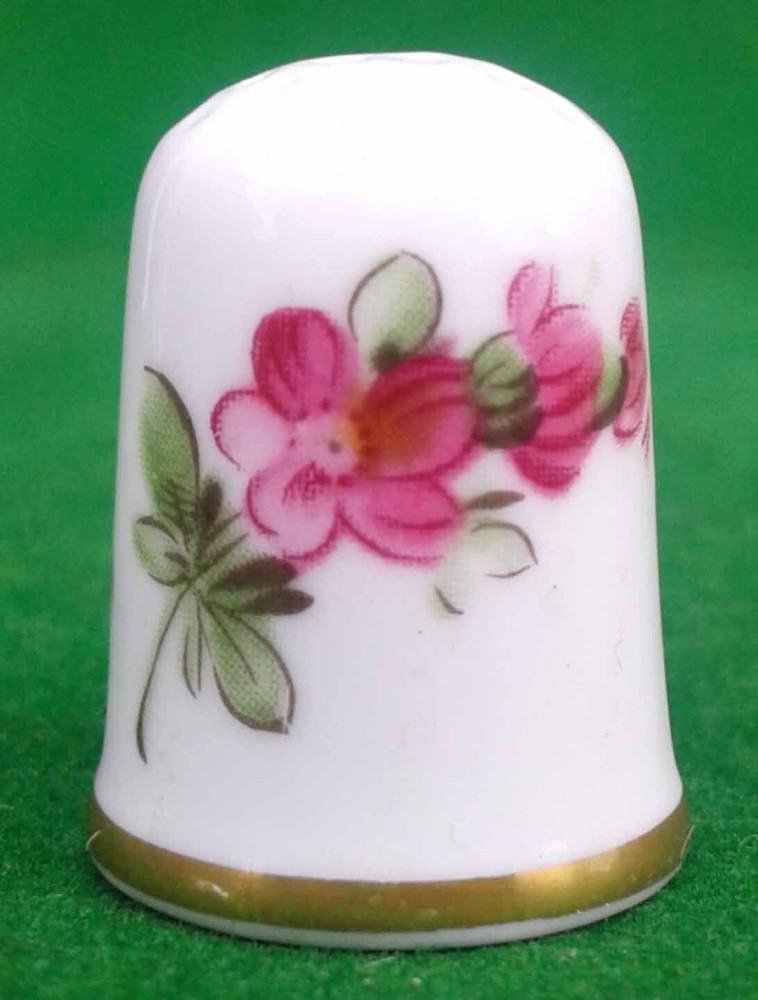 9 CAVERSWALL BONE CHINA THIMBLES.