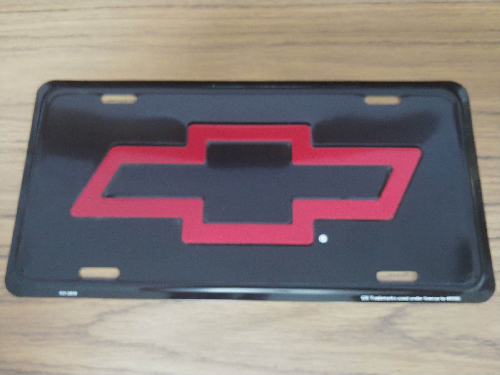 Vintage Chevy License Plate Red Bowtie Bow-Tie Embossed Auto Tag Metal Old Stock