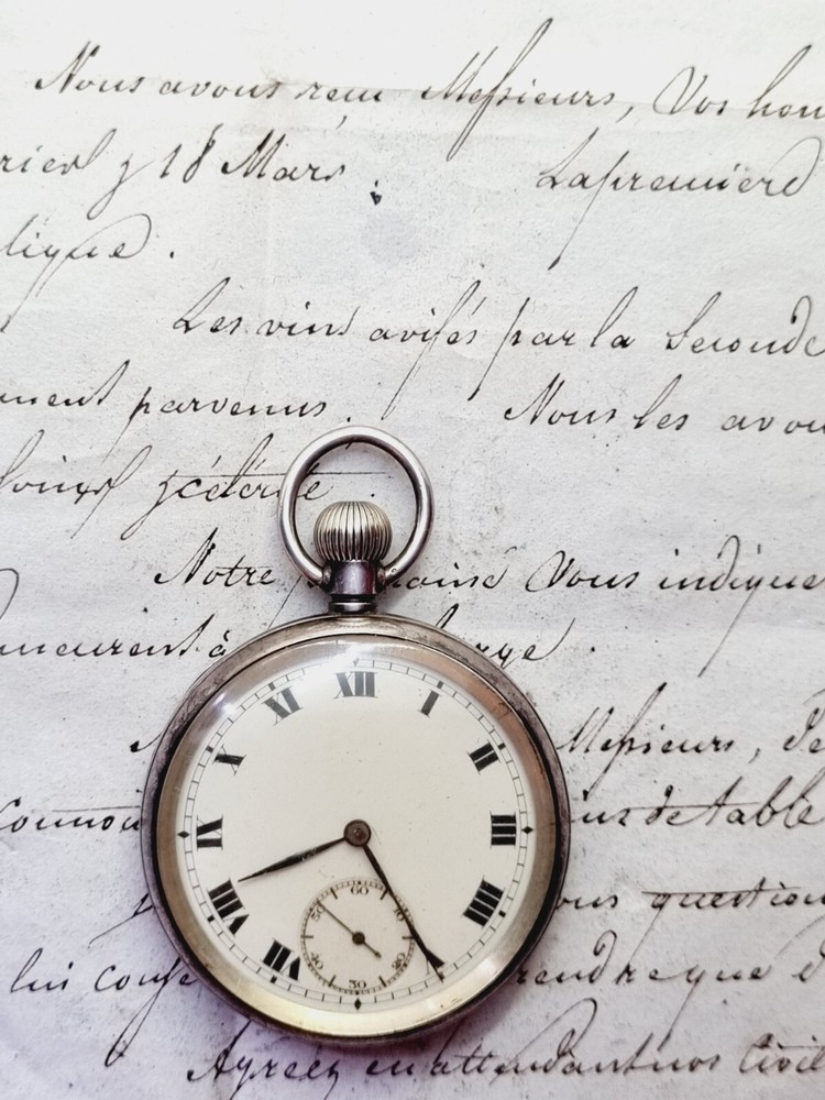 silver open face pocket watch