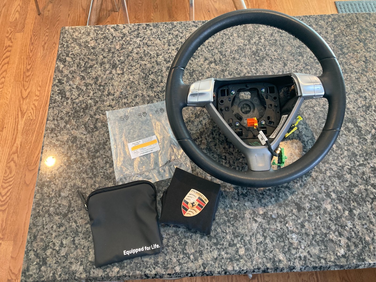 PORSCHE DESIGN OEM FACTORY STEERING WHEEL PROTECTIVE COVER IN BLACK W/CREST. NEW