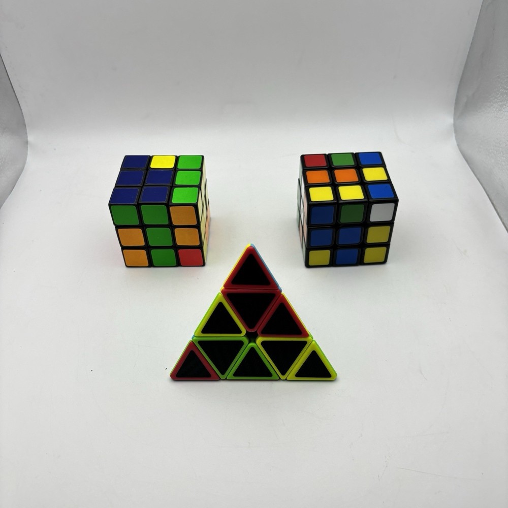 2 - Rubiks Cubes and 1 - Pyraminx Triangle Puzzle. VG Condition.