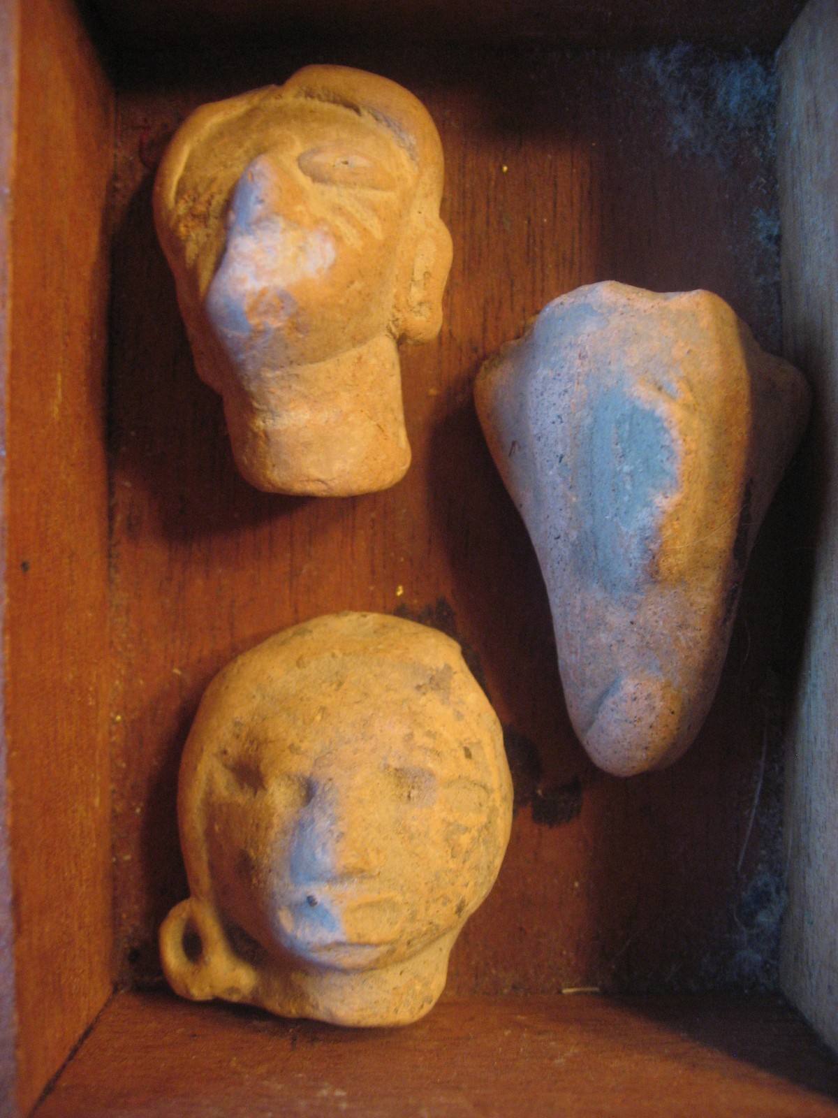 Antique Pre-Columbian Artifacts Box of 12 Hand Carved Stone Face Heads on Wood