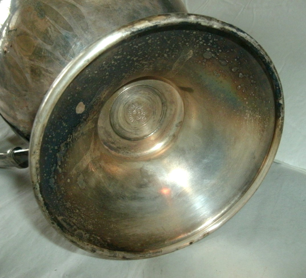 VINTAGE SILVER ON COPPER PITCHER, ENBLEM ON BOTTOM, 9 1/2" TALL