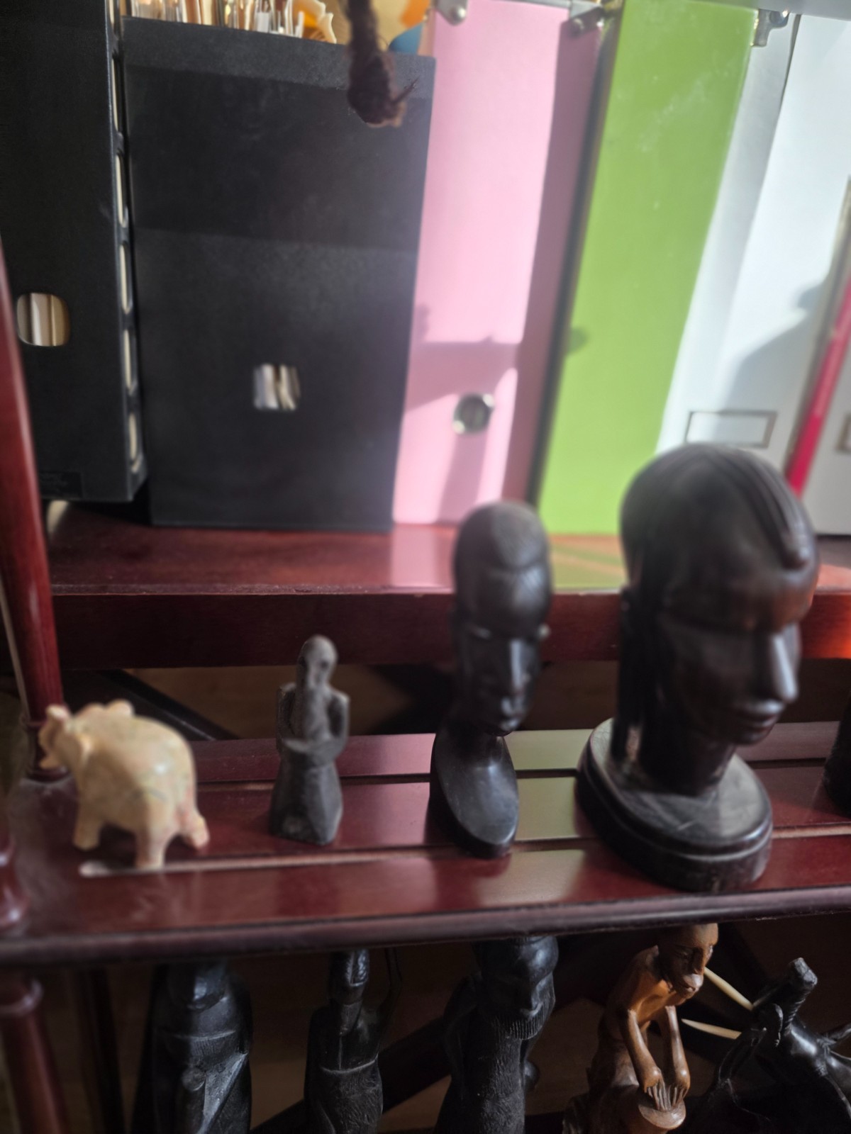 Set of carved statues from black wood, stone, bronze.