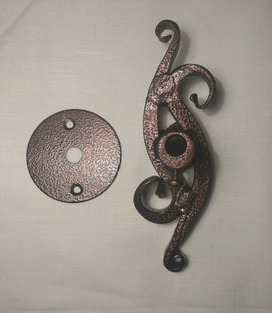 Wrought iron handle for the fireplace