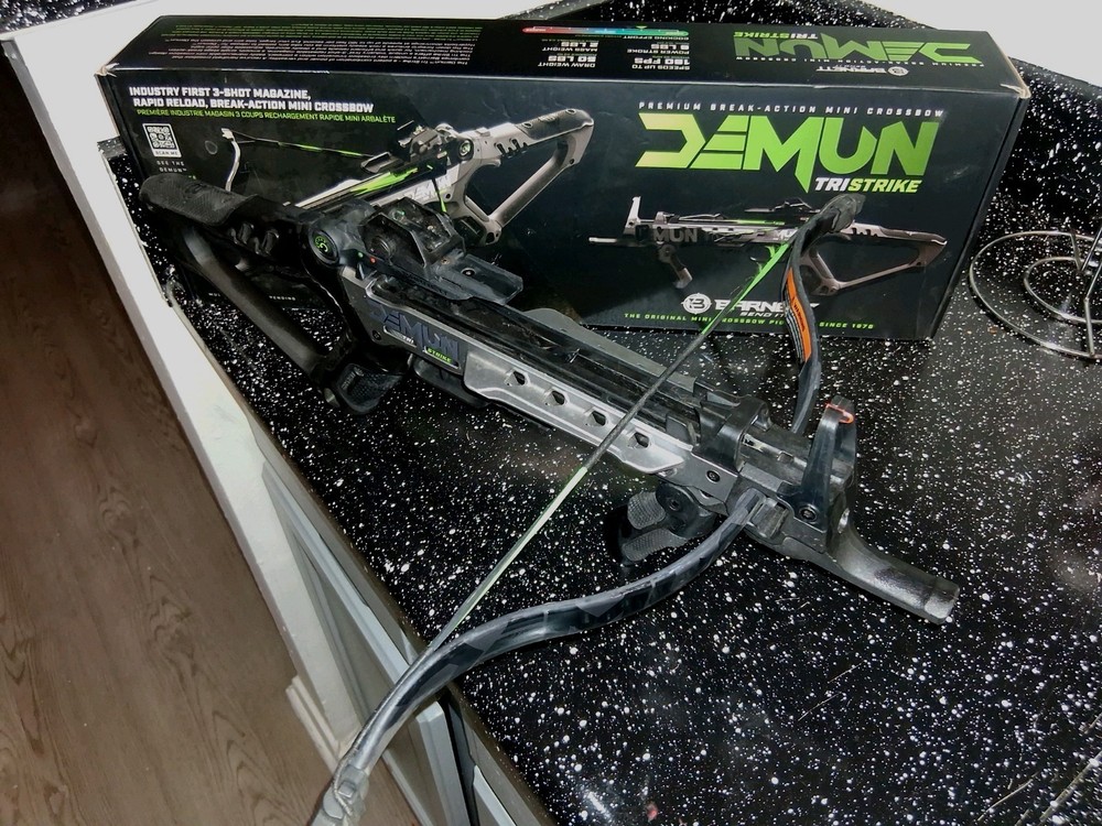 Black crossbow with green