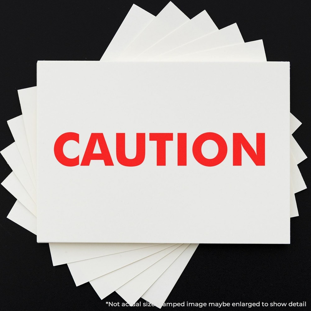 Caution Rubber Stamp Size 1/2" Tall x 1-1/2" Wide