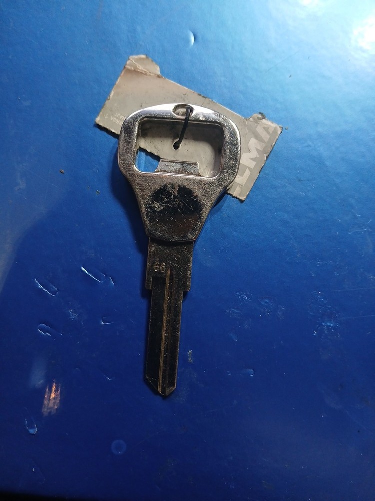 New Uncut Key With Bottle Opener Tool