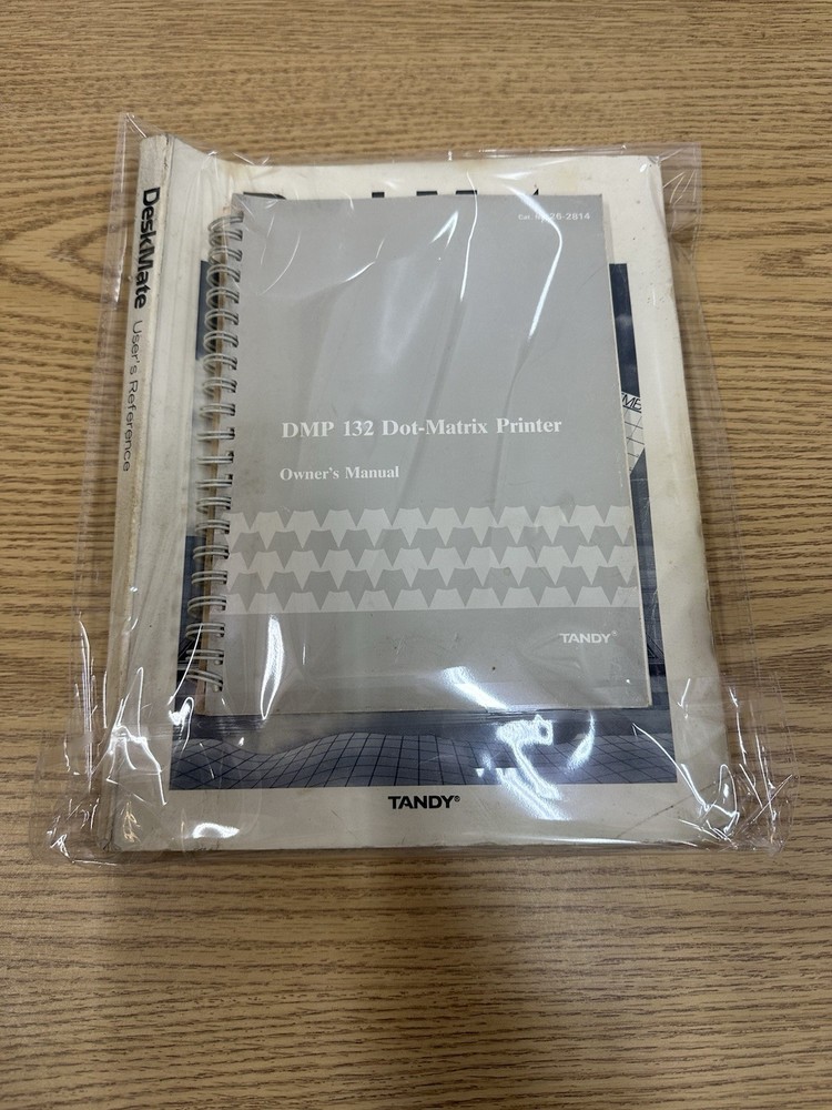 DeskMate TANDY USER REFERENCE MANUAL and DMP 132 Dot-Matrix Printer Manual.