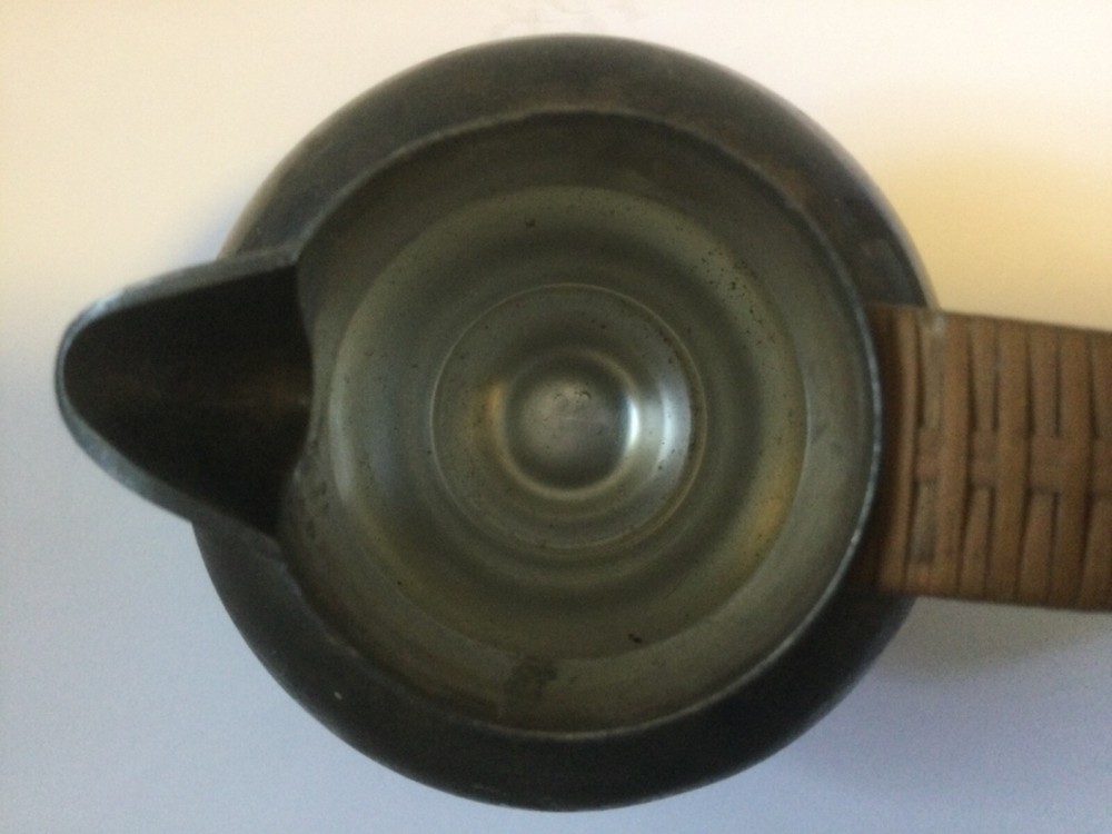 vintage silver plated pitcher with rattan handle