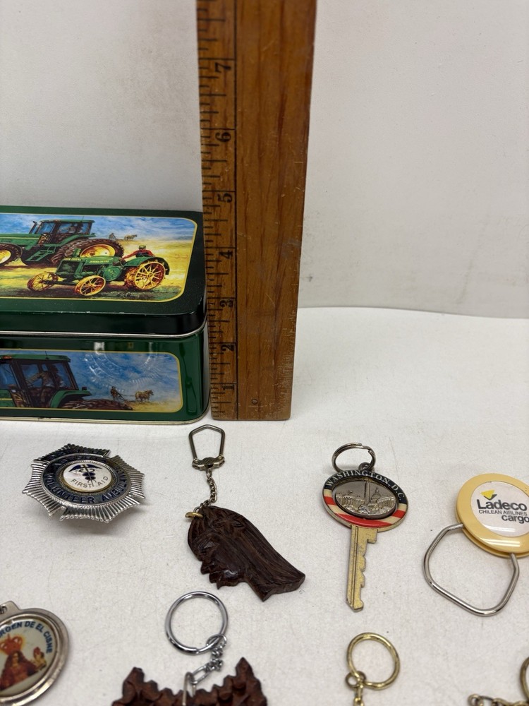 32 Vintage Key Chains And a John Deere Tin Box