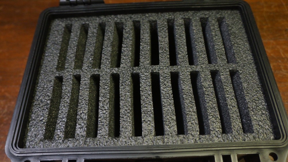 NICE BLACK HARD PLASTIC BOX WITH 20 GRADED COIN SLOTS--DOESNT LOCK TABS SECURE