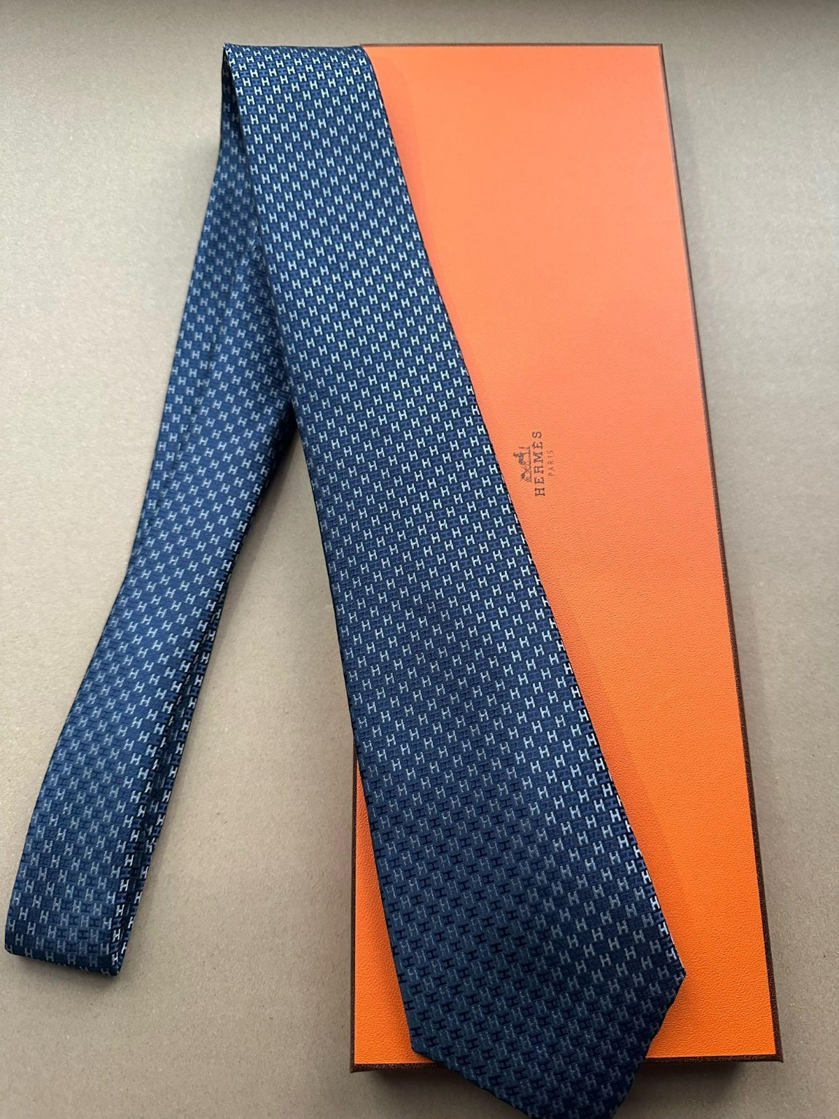 HERMES BLUE SILK TIE -- ALL OVER H MONOGRAM JACQUARD