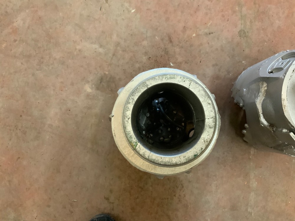 9 7/8 TCI button bits. Reverse circulation. Bored center hole. Hughes