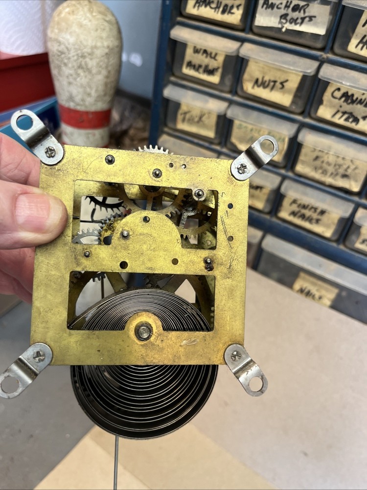 ANTIQUE E INGRAHAM CO CLOCK MOVEMENT AND PENDULUM BOB