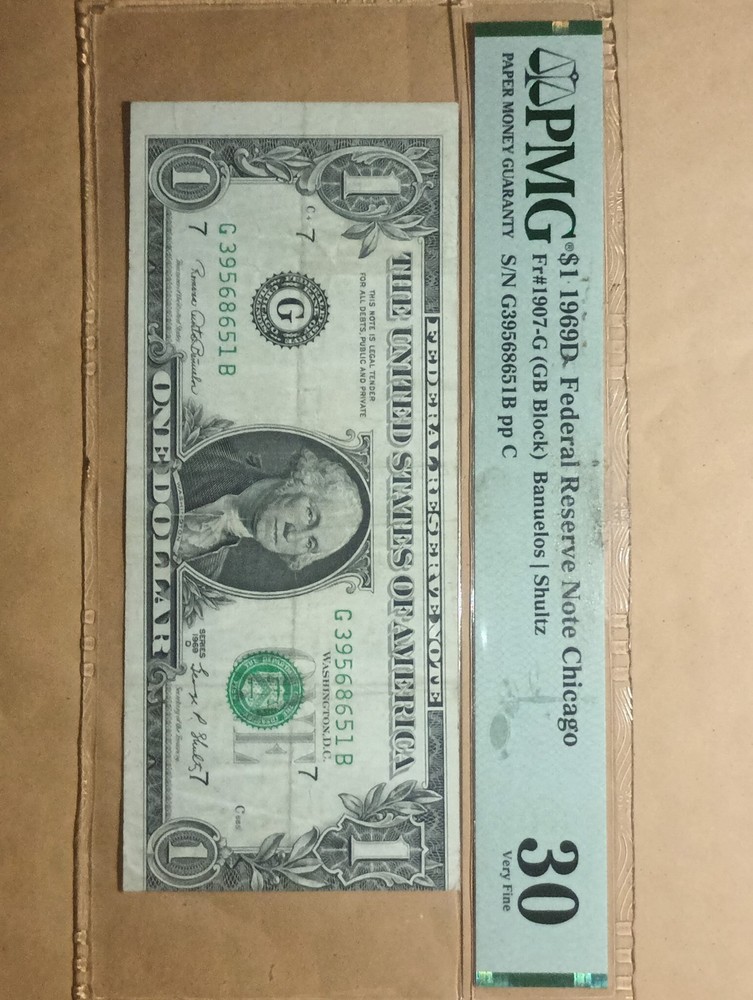 grated 1969 $1 bill. Miss alignment error