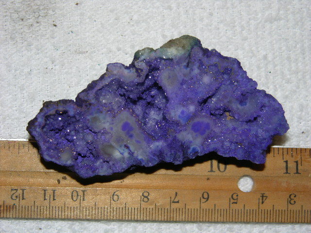 Geode cut & polished half with colored crystal center 3 inch E46